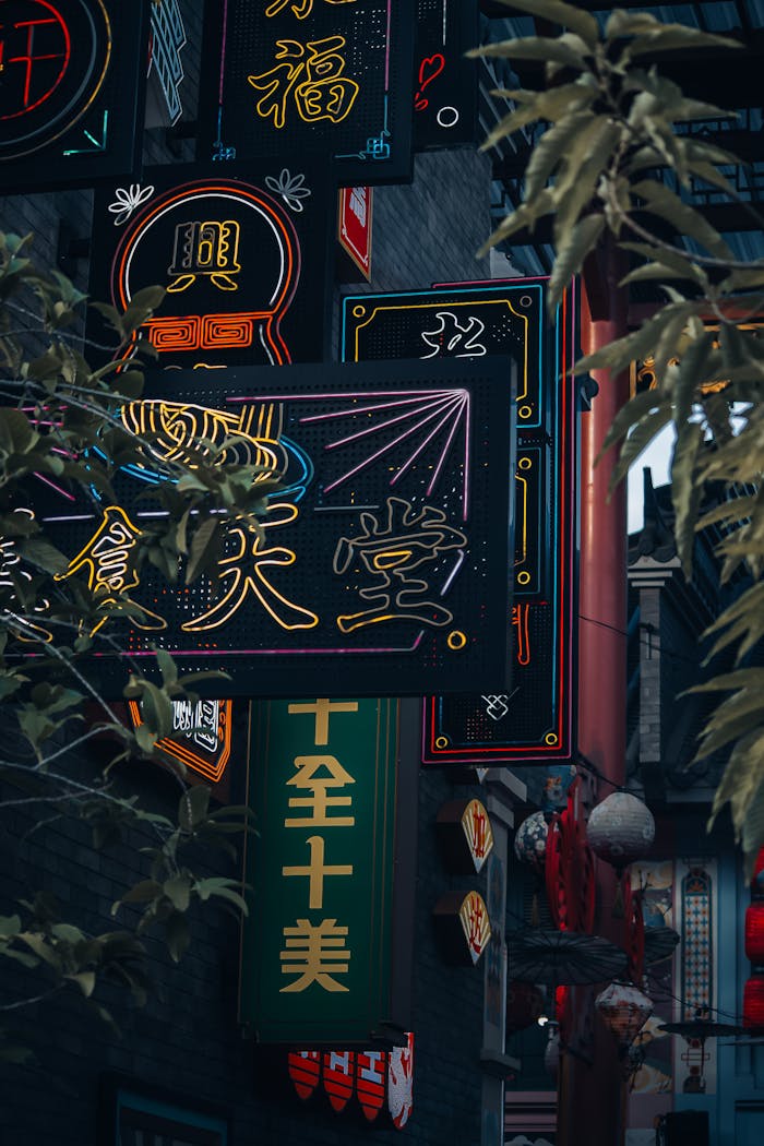 Colorful neon signs illuminate Jakarta's Chinatown, showcasing traditional Chinese aesthetics.